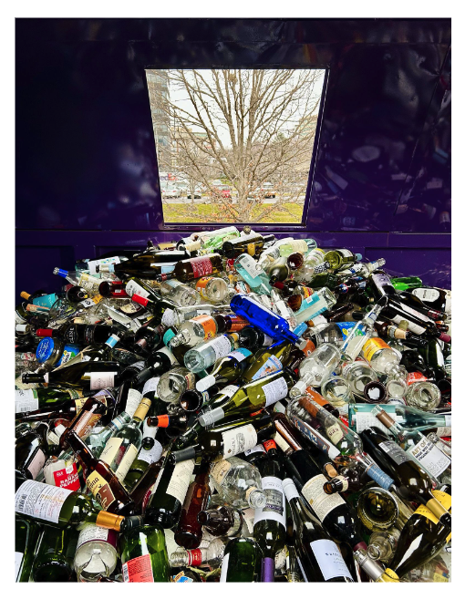 glass in recycling dumpster bin