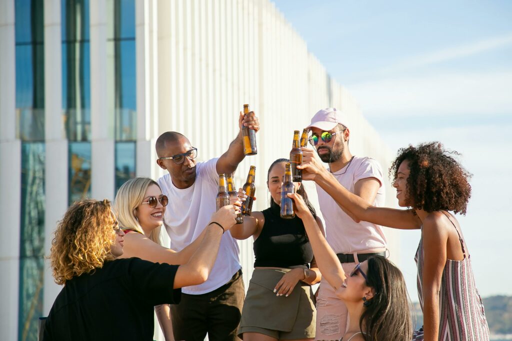 cheers with glass bottles